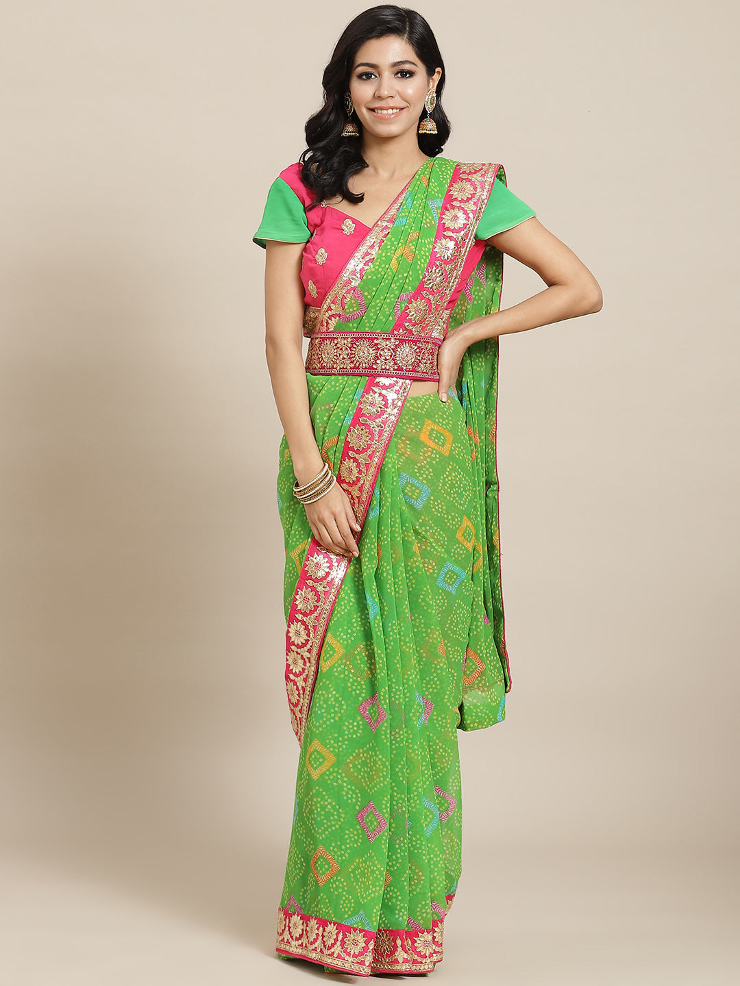 Chhabra 555 Green Bandhani Print Georgette Belted Saree with Multicolor Gota Patti Embroidery

Color: Green

Type: Bandhani Sarees

Pattern: Embroidered

Pattern Type: Bandhani

Ornamentation: Gotta Patti

Border: Embellished

Fabric: Georgette

Saree length: 5.40 mtr., Width: 1.10 mtr, Blouse length: 0.75 mtr
Dry Clean only

The CAD image gives a detailed look of the actual blouse piece that comes with this saree. The blouse used by the model in the pictures is only for styling purpose.