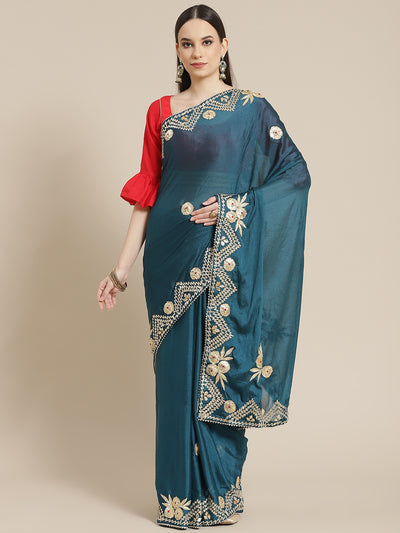 Chhabra 555 Midnight Blue Chinon Crape Gota Patti Embellished Saree With Contrast Blouse

Color: Teal

Type: NA Sarees

Pattern: Embellished

Pattern Type: Floral

Ornamentation: Gotta Patti

Border: Embroidered

Fabric: Poly Crepe

Saree length: 5.30 mtr., Width: 1.10 mtr, Blouse length: 0.80 mtr
Dry Clean only

The CAD image gives a detailed look of the actual blouse piece that comes with this saree. The blouse used by the model in the pictures is only for styling purpose.