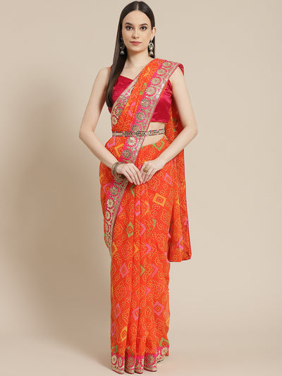 Chhabra 555 Orange Bandhani Print Georgette Belted Saree with Multicolor Gota Patti Embroidery

Color: Orange

Type: Bandhani Sarees

Pattern: Embroidered

Pattern Type: Bandhani

Ornamentation: Gotta Patti

Border: Embellished

Fabric: Poly Georgette

Saree length: 5.40 mtr., Width: 1.10 mtr, Blouse length: 0.75 mtr
Dry Clean only

The CAD image gives a detailed look of the actual blouse piece that comes with this saree. The blouse used by the model in the pictures is only for styling purpose.