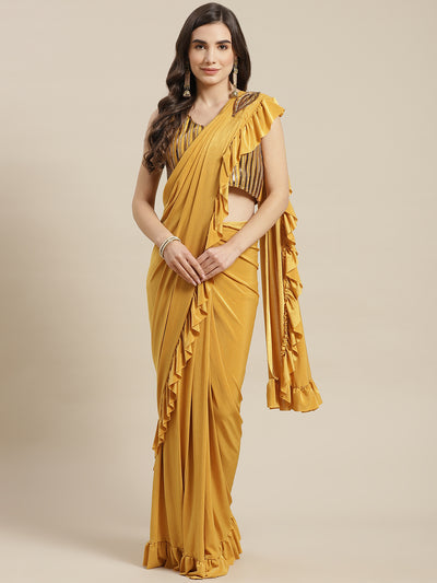 Chhabra 555 Mustard Pre-Stitched Draped Metallic Applique Embroidery Ruffled Saree 

Color: Yelllow

Type: NA Sarees

Pattern: Embellished

Pattern Type: Embellished

Ornamentation: Patchwork

Border: No Border

Fabric: Viscose Rayon

Saree length: 5.50 mtr., Width: 1.10 mtr, Blouse Height: 14.5 inches
Dry Clean only. Saree Fabric is Lycra.

The CAD image gives a detailed look of the actual blouse piece that comes with this saree. The blouse used by the model in the pictures is only for styling purpose.