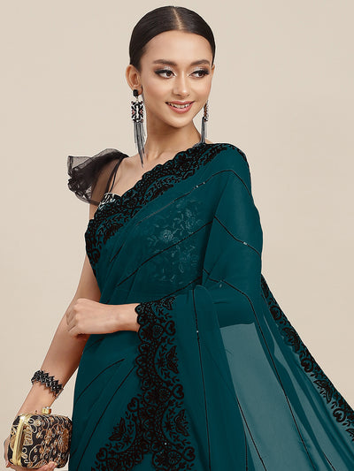 Chhabra 555 Teal Blue Bright Georgette Saree With Black Resham Sequinned Embroidery & Scalloped Border