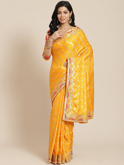 Chhabra 555 Mustard  Leheriya Dupion Silk Saree Embellished With Gota Patti Embroidered Red Border

Color: Mustard

Type: Leheriya Sarees

Pattern: Embroidered

Pattern Type: Leheriya

Ornamentation: NA

Border: Embellished

Fabric: Silk Blend

Saree: 5.20 mtr., Width: 1.10 mtr, Blouse: 0.90 mtr
Dry Clean

The CAD image gives a detailed look of the actual blouse piece that comes with this saree. The blouse used by the model in the pictures is only for styling purpose.