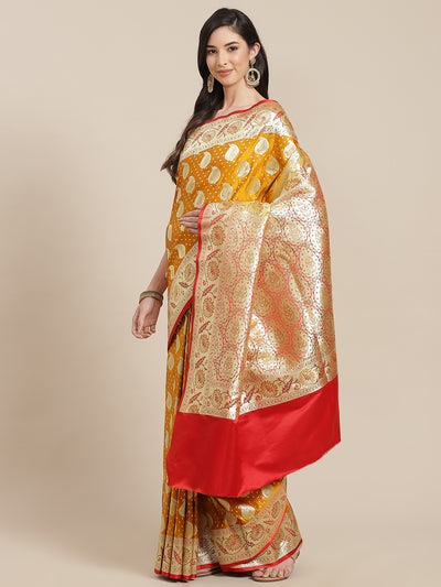 Chhabra 555 Mustard Kanjeevaram Wedding Silk Saree With Gold  Zari Ambi Weaves & Red Contrast Pallu

Color: Mustard & Red

Type: Kanjeevaram Sarees

Pattern: Woven Design

Pattern Type: Paisley

Ornamentation: Zari

Border: Zari

Fabric: Silk Blend

Saree: 5.85 mtr., Width: 1.15 mtr, Blouse: 0.90 mtr
Dry Clean

The CAD image gives a detailed look of the actual blouse piece that comes with this saree. The blouse used by the model in the pictures is only for styling purpose.