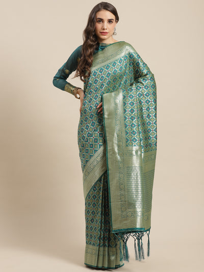 Chhabra 555 Teal Green Silk Meenakari Banarasi Saree Embellished With Resham Weaving

Color: Teal Green

Type: Banarasi Sarees

Pattern: Embroidered

Pattern Type: Woven Design

Ornamentation: Zari

Border: Woven Design

Fabric: Art Silk

Saree length: 5.50 mtr., Width: 1.10 mtr, Blouse length: 0.70 mtr
Dry Clean

The CAD image gives a detailed look of the actual blouse piece that comes with this saree. The blouse used by the model in the pictures is only for styling purpose.