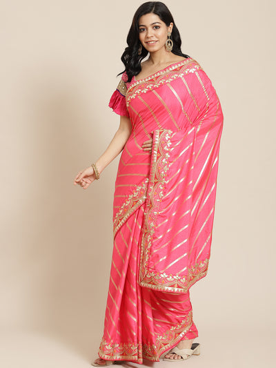 Chhabra 555 Coral Pink Lehariya Dupion Silk Saree Embellished With Gota Patti Embroidered  Border

Color: Coral pink

Type: Leheriya Sarees

Pattern: Embroidered

Pattern Type: Leheriya

Ornamentation: NA

Border: Embellished

Fabric: Silk Blend

Saree: 5.20 mtr., Width: 1.10 mtr, Blouse: 0.90 mtr
Dry Clean

The CAD image gives a detailed look of the actual blouse piece that comes with this saree. The blouse used by the model in the pictures is only for styling purpose.