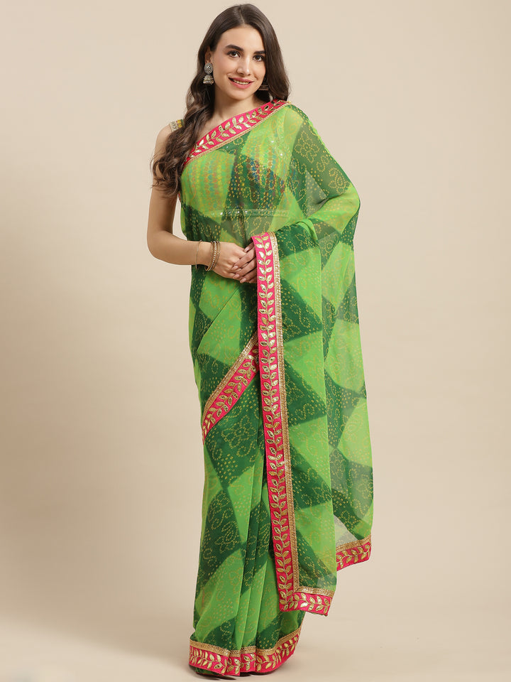 Chhabra 555 Green Georgette Bandhani Print Saree Embellished & Contrast Gota Patti Jaipuri Border

Color: Green

Type: Bandhani Sarees

Pattern: Printed

Pattern Type: Bandhani

Ornamentation: Gotta Patti

Border: Embroidered

Fabric: Georgette

Saree length: 5.40 mtr., Width: 1.10 mtr, Blouse length: 0.70 mtr
Dry Clean

The CAD image gives a detailed look of the actual blouse piece that comes with this saree. The blouse used by the model in the pictures is only for styling purpose.