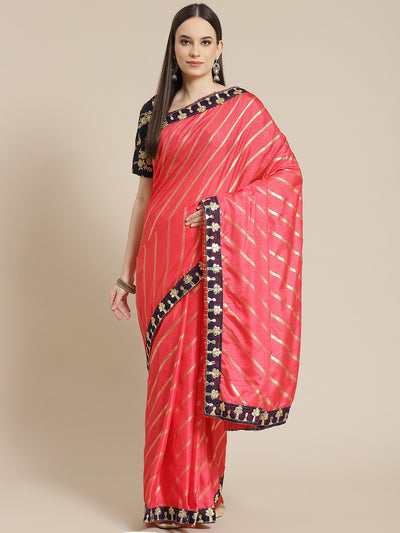 Chhabra 555 Gajari Pink Foil print Leheriya Style Saree with Gota Patti Embroidery Border

Color: Coral

Type: Leheriya Sarees

Pattern: Embellished

Pattern Type: Leheriya

Ornamentation: Gotta Patti

Border: Embroidered

Fabric: Silk Blend

Saree length: 5.00 mtr., Width: 1.10 mtr, Blouse length: 0.70 mtr
Dry Clean only

The CAD image gives a detailed look of the actual blouse piece that comes with this saree. The blouse used by the model in the pictures is only for styling purpose.