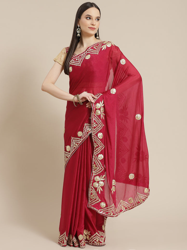 Chhabra 555 Magenta Chinon Crape Gota Patti Embellished Saree With Contrast Lavender Blouse

Color: Magenta

Type: NA Sarees

Pattern: Embellished

Pattern Type: Floral

Ornamentation: Gotta Patti

Border: Embroidered

Fabric: Crepe

Saree length: 5.30 mtr., Width: 1.10 mtr, Blouse length: 0.80 mtr
Dry Clean only

The CAD image gives a detailed look of the actual blouse piece that comes with this saree. The blouse used by the model in the pictures is only for styling purpose.