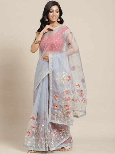 Chhabra 555 Grey Organza Jaipuri Saree with Gota Patti & Resham Embroidery and Contrast Blouse

Color: Grey

Type: NA Sarees

Pattern: Embellished

Pattern Type: Floral

Ornamentation: Gotta Patti

Border: Embroidered

Fabric: Organza

Saree length: 5.40 mtr., Width: 1.10 mtr, Blouse length: 0.70 mtr
Dry Clean only

The CAD image gives a detailed look of the actual blouse piece that comes with this saree. The blouse used by the model in the pictures is only for styling purpose.