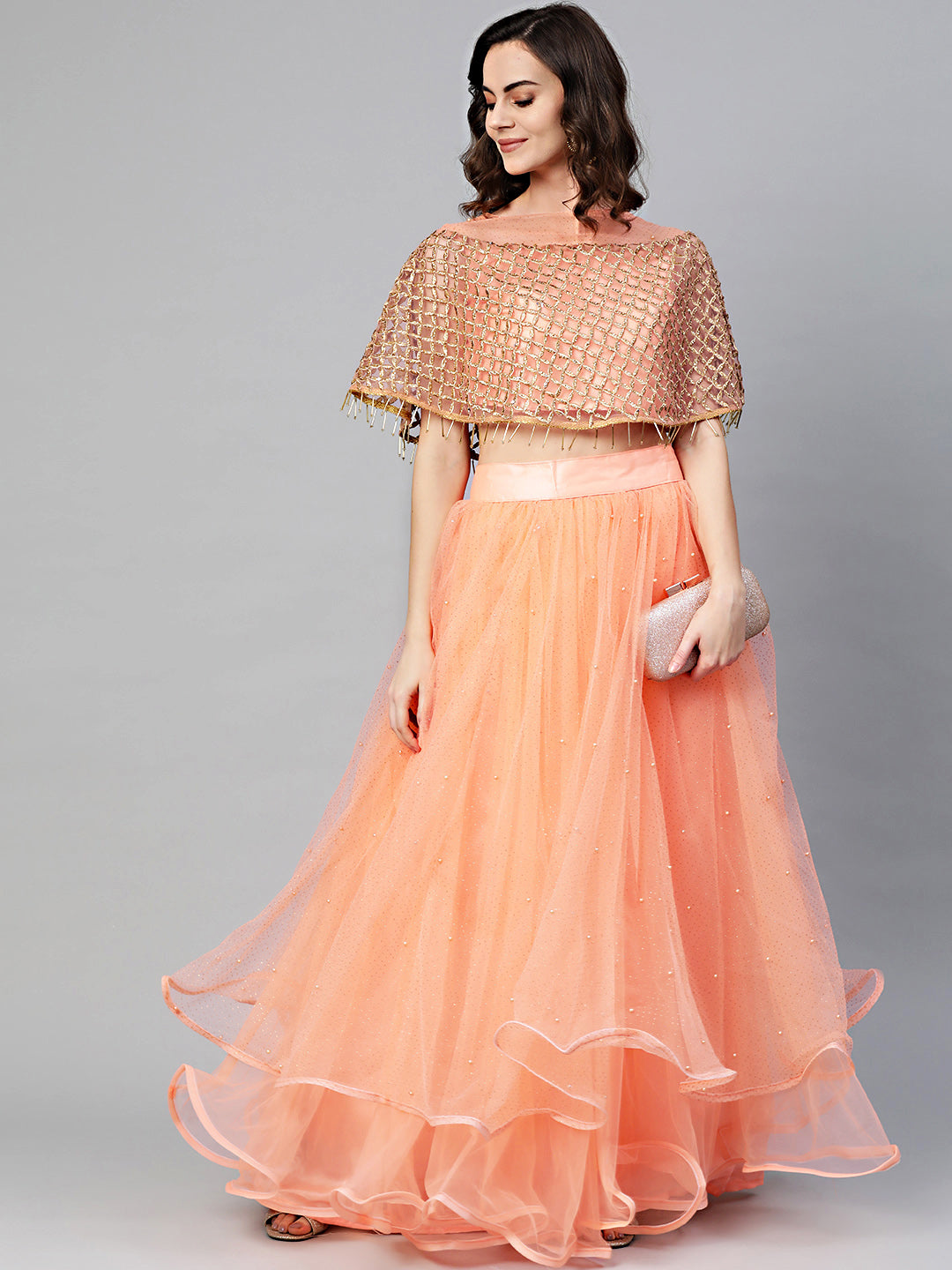 Cape Style Tassled Crop Top Blouse and foil print layered lehenga