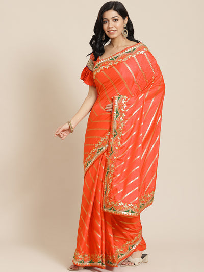 Chhabra 555 Orange Lehariya Dupion Silk Saree Embellished With Gota Patti Embroidered  Border

Color: Orange

Type: Leheriya Sarees

Pattern: Embroidered

Pattern Type: Leheriya

Ornamentation: Gotta Patti

Border: Embroidered

Fabric: Silk Blend

Saree: 5.20 mtr., Width: 1.10 mtr, Blouse: 0.90 mtr
Dry Clean Only

The CAD image gives a detailed look of the actual blouse piece that comes with this saree. The blouse used by the model in the pictures is only for styling purpose.