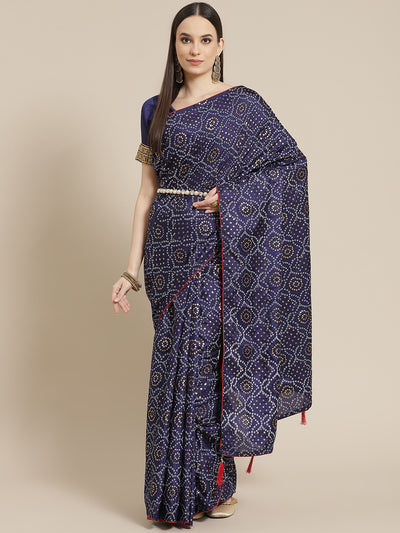 Chhabra 555 Navy Blue Silk Blend Batik Bandhani Print Saree With Contrast Blouse & Matching Belt 

Color: Navy Blue

Type: Bandhani Sarees

Pattern: Printed

Pattern Type: Bandhani

Ornamentation: Beads and Stones

Border: No Border

Fabric: Silk Blend

Saree length: 5.10 mtr., Width: 1.10 mtr, Blouse length: 0.70 mtr
Dry Clean only

The CAD image gives a detailed look of the actual blouse piece that comes with this saree. The blouse used by the model in the pictures is only for styling purpose.