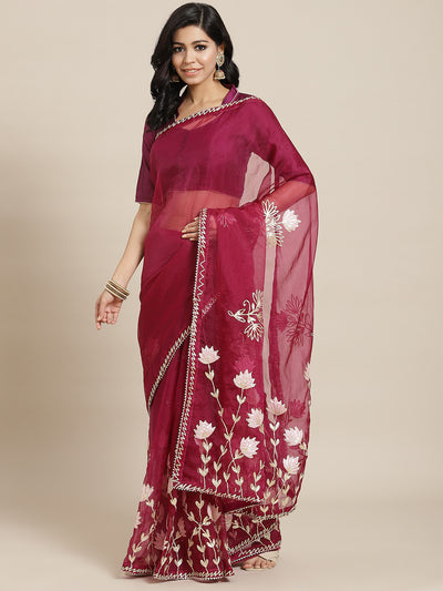 Chhabra 555 Wine Organza Jaipuri Saree with Gota Patti & Resham Embroidery and Contrast Blouse

Color: Burgundy

Type: NA Sarees

Pattern: Embellished

Pattern Type: Floral

Ornamentation: Gotta Patti

Border: Embroidered

Fabric: Organza

Saree length: 5.40 mtr., Width: 1.10 mtr, Blouse length: 0.70 mtr
Dry Clean only

The CAD image gives a detailed look of the actual blouse piece that comes with this saree. The blouse used by the model in the pictures is only for styling purpose.