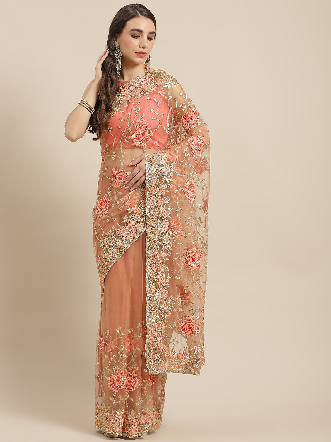 Chhabra 555 Peach Net Floral Zari & Resham Embroidered Saree & Stone Work & Cutwork Border

Color: Peach

Type: NA Sarees

Pattern: Embroidered

Pattern Type: Floral

Ornamentation: Zari

Border: Embroidered

Fabric: Net

Saree length: 5.50 mtr., Width: 1.10 mtr, Blouse length: 0.70 mtr
Dry Clean

The CAD image gives a detailed look of the actual blouse piece that comes with this saree. The blouse used by the model in the pictures is only for styling purpose.