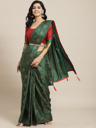 Chhabra 555 Deep Green Batik Bandhani Pattern Silk Saree With Contrast Blouse & Matching Belt 

Color: Green

Type: Bandhani Sarees

Pattern: Printed

Pattern Type: Bandhani

Ornamentation: Beads and Stones

Border: No Border

Fabric: Silk Blend

Saree length: 5.10 mtr., Width: 1.10 mtr, Blouse length: 0.70 mtr
Dry Clean only

The CAD image gives a detailed look of the actual blouse piece that comes with this saree. The blouse used by the model in the pictures is only for styling purpose.