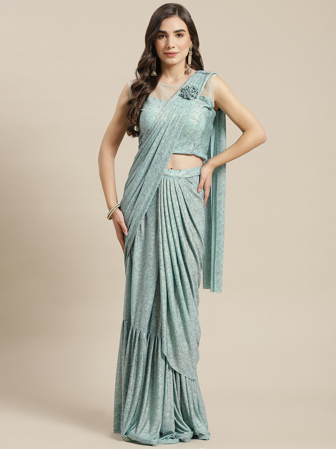 Chhabra 555 Ruffled Pre-Stitched Draped Mint Green Shimmer Georgette Embellished Pleated Saree

Color: Sea Green

Type: NA Sarees

Pattern: Printed

Pattern Type: Abstract

Ornamentation: Embroidered

Border: No Border

Fabric: Georgette

Saree length: 5.50 mtr., Width: 1.10 mtr, Blouse Height: 16 inches
Dry Clean only

The CAD image gives a detailed look of the actual blouse piece that comes with this saree. The blouse used by the model in the pictures is only for styling purpose.