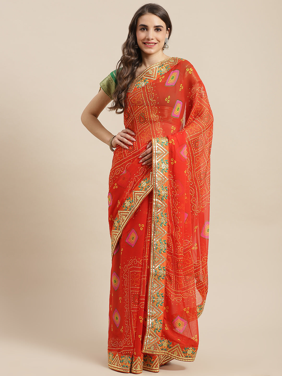 Chhabra 555 Orange Jaipur Bandhani Prints Geogette Saree With Resham & Gota Patti Embroidery Border

Color: Orange

Type: Bandhani Sarees

Pattern: Printed

Pattern Type: Bandhani

Ornamentation: Gotta Patti

Border: Embroidered

Fabric: Georgette

Saree length: 5.40 mtr., Width: 1.10 mtr, Blouse length: 0.70 mtr
Dry Clean

The CAD image gives a detailed look of the actual blouse piece that comes with this saree. The blouse used by the model in the pictures is only for styling purpose.