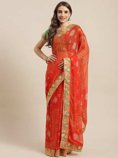 Chhabra 555 Orange Jaipur Bandhani Prints Geogette Saree With Resham & Gota Patti Embroidery Border

Color: Orange

Type: Bandhani Sarees

Pattern: Printed

Pattern Type: Bandhani

Ornamentation: Gotta Patti

Border: Embroidered

Fabric: Poly Georgette

Saree length: 5.40 mtr., Width: 1.10 mtr, Blouse length: 0.70 mtr
Dry Clean

The CAD image gives a detailed look of the actual blouse piece that comes with this saree. The blouse used by the model in the pictures is only for styling purpose.