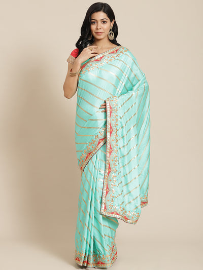 Chhabra 555 Pastel Blue Leheriya Dupion Silk Saree Embellished With Gota Patti Embroidered Border

Color: Pastel Blue

Type: Leheriya Sarees

Pattern: Embroidered

Pattern Type: Leheriya

Ornamentation: NA

Border: Embellished

Fabric: Silk Blend

Saree: 5.20 mtr., Width: 1.10 mtr, Blouse: 0.90 mtr
Dry Clean

The CAD image gives a detailed look of the actual blouse piece that comes with this saree. The blouse used by the model in the pictures is only for styling purpose.